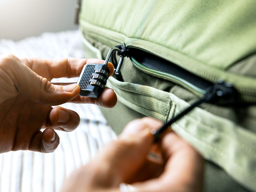 Person using luggage lock