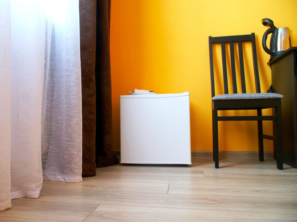 Mini-fridge next to chair