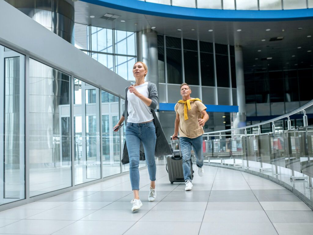 Travelers rushing through airport