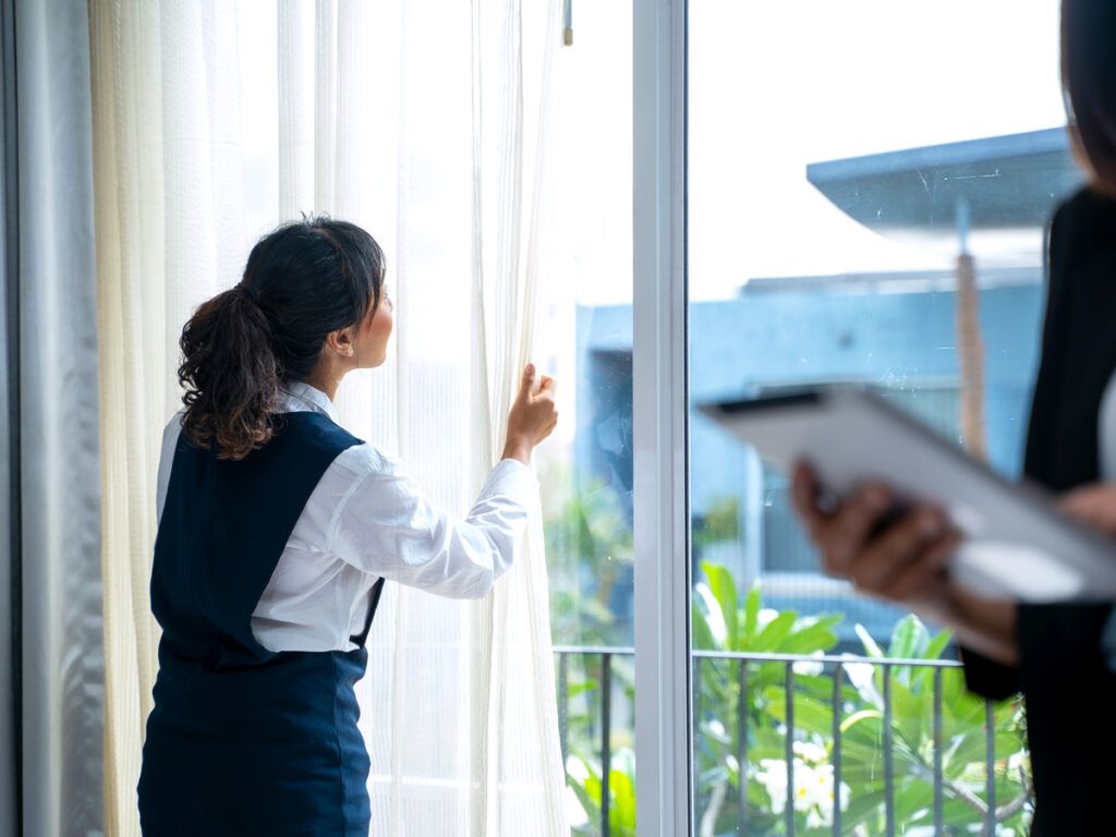 Hotel staff examining room