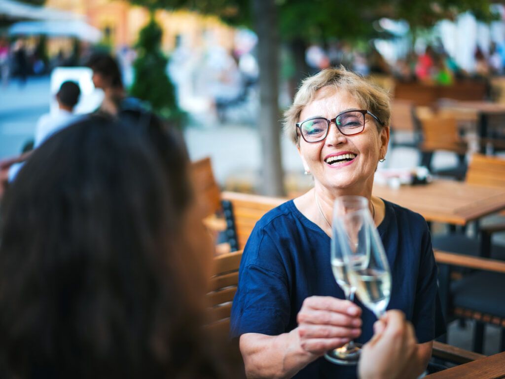 Two people clinking Champagne flutes