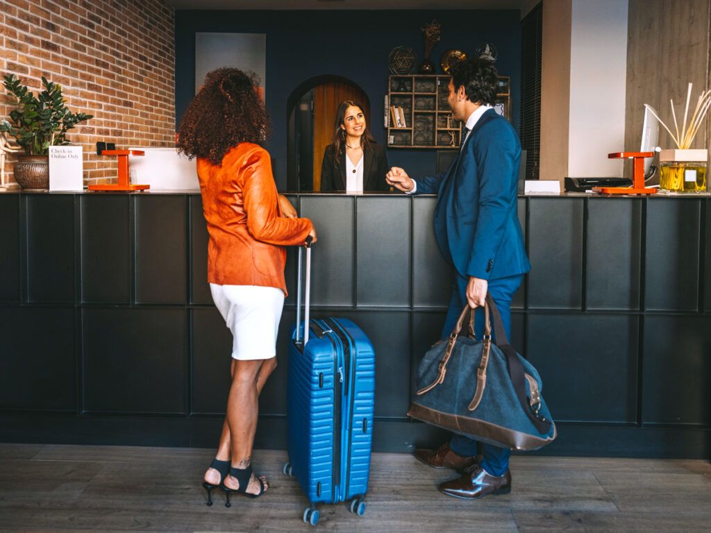 Hotel guests at check-in desk
