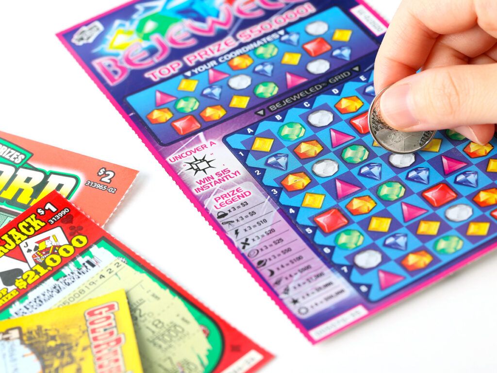 Person scratching lottery ticket