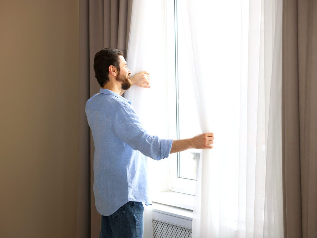 Hotel guest looking out window