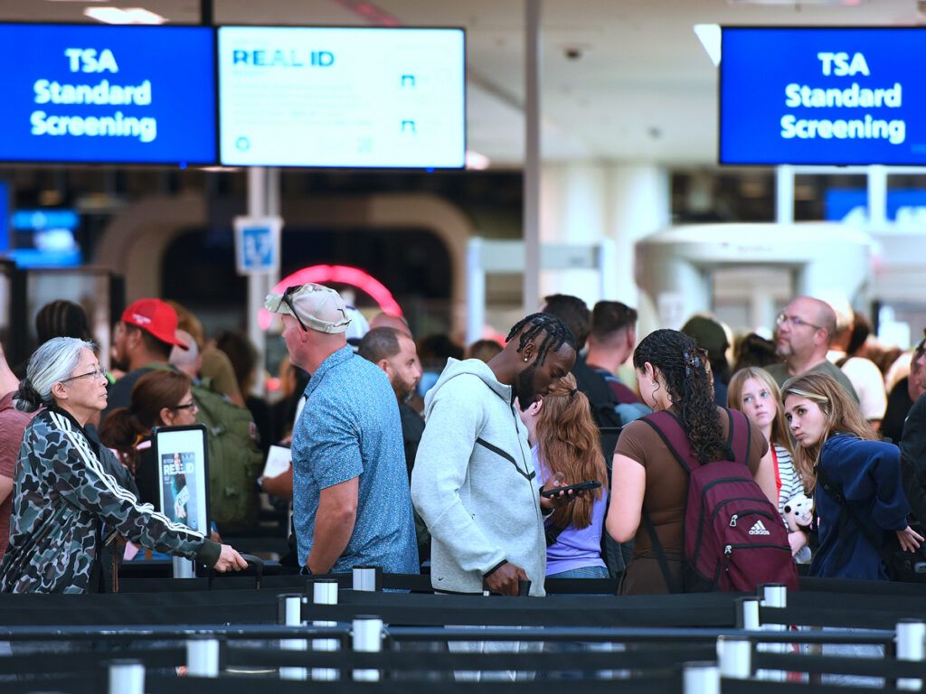Travelers in airport security line