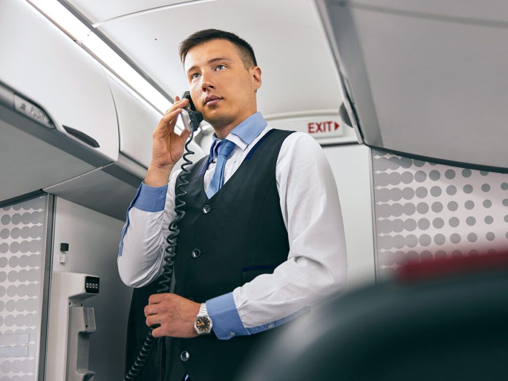 Flight attendant making onboard announcement