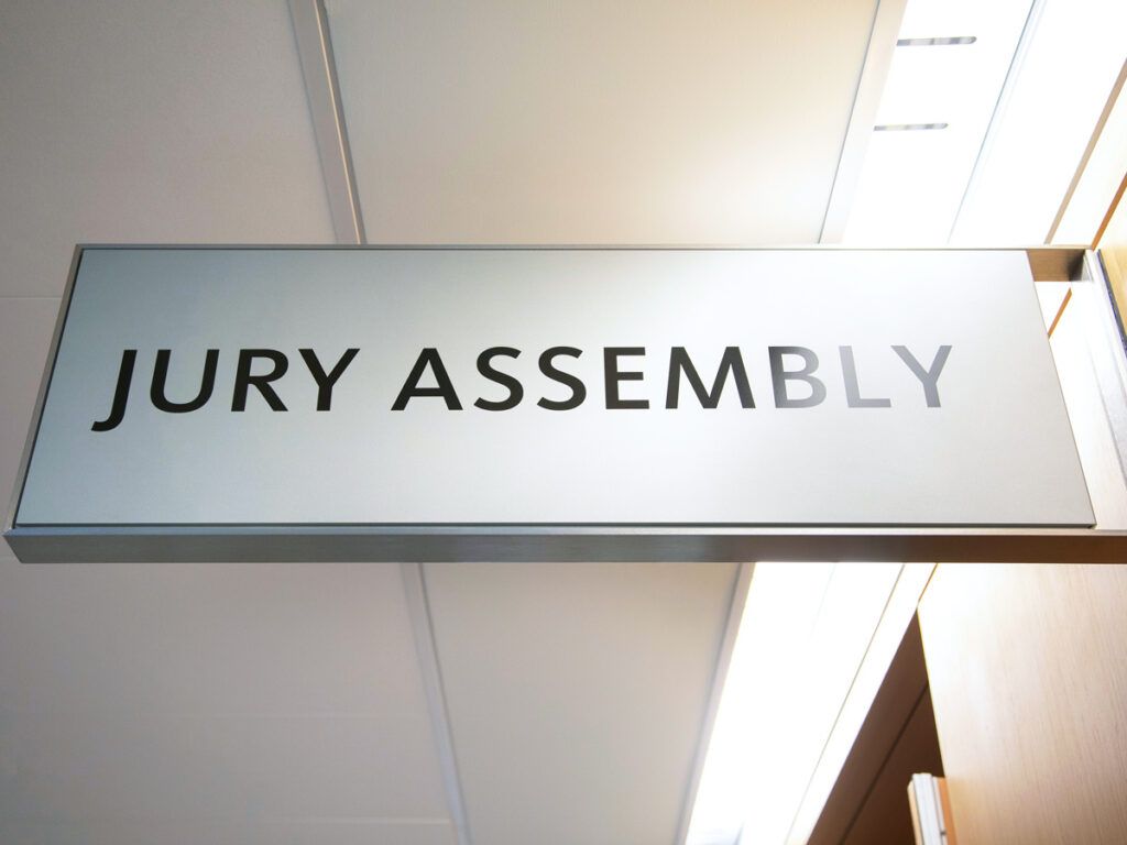 Sign for jury assembly in courtroom