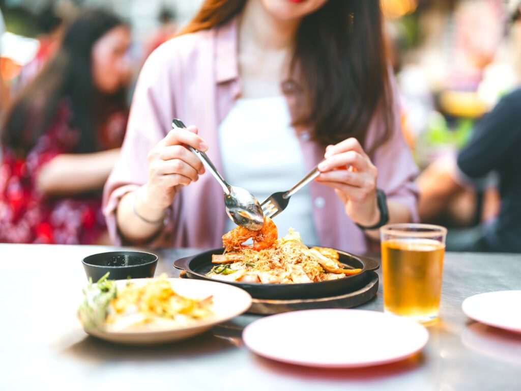Person eating noodles