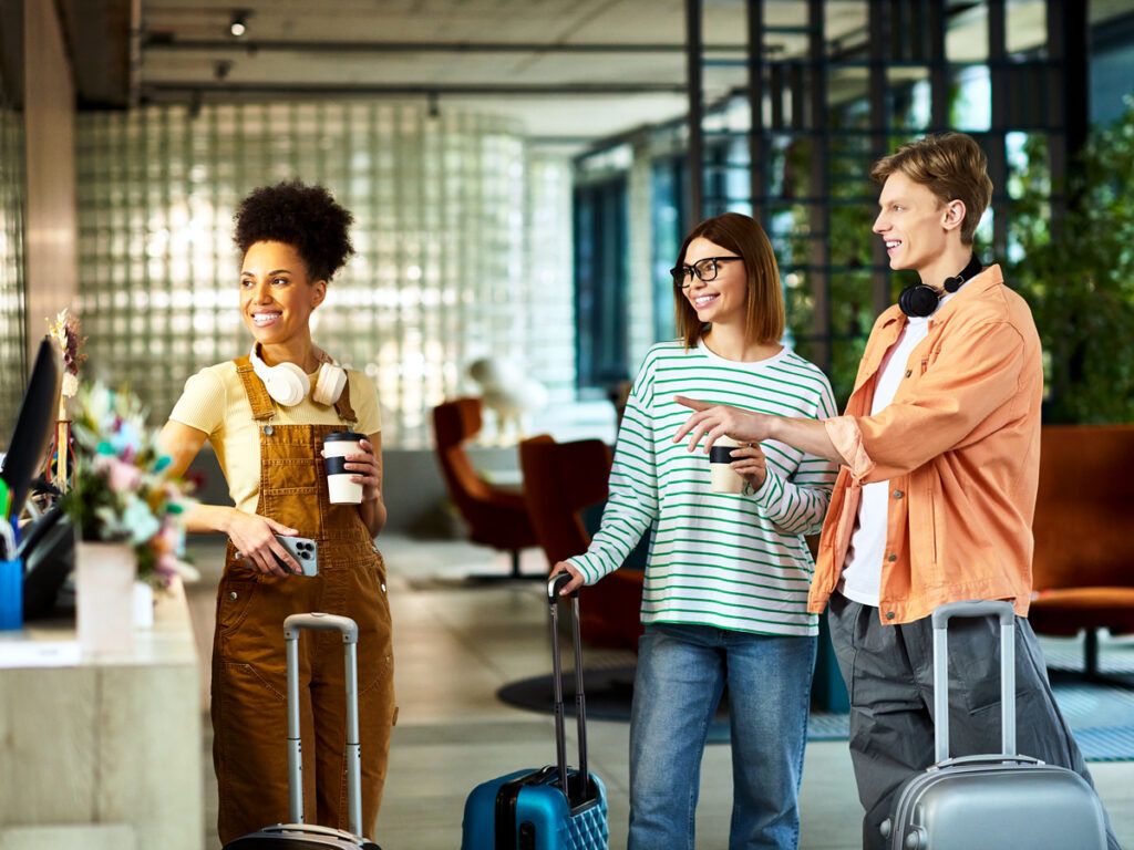 Group of travelers at hotel reception desk