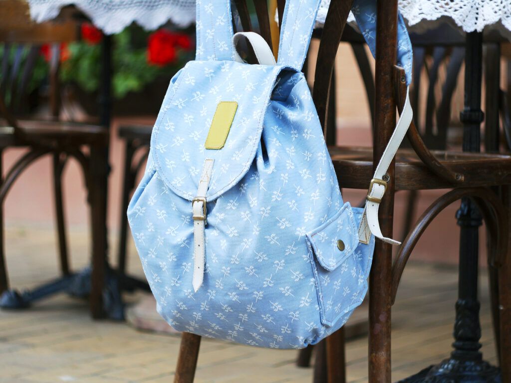 Backpack hanging on dining chair