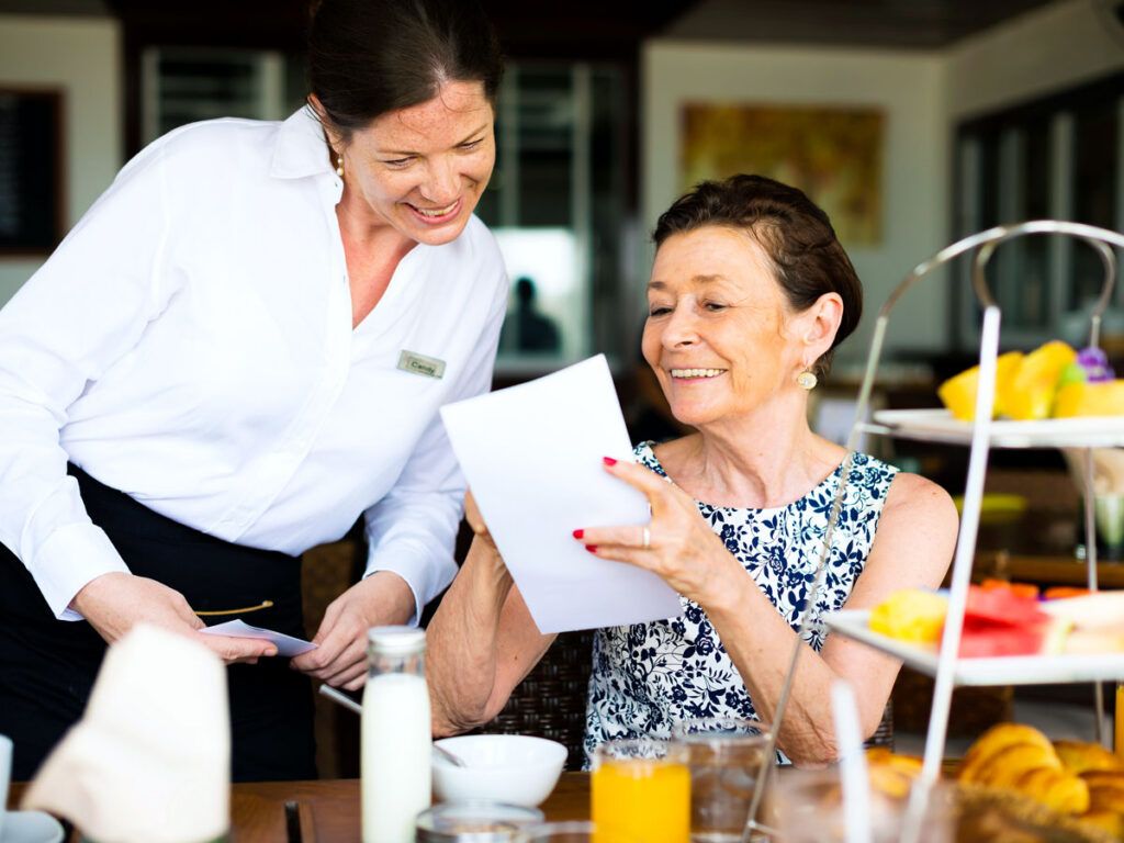 Hotel guest ordering breakfast