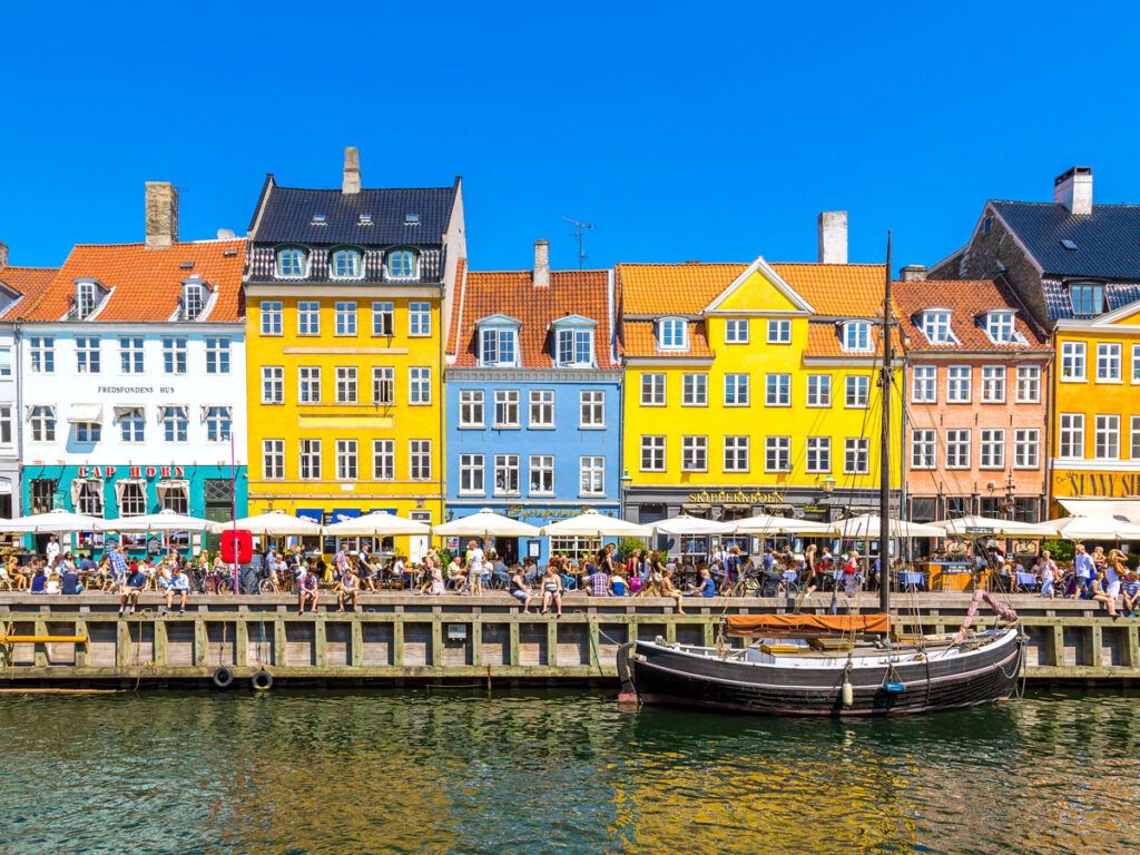 Crowds and colorful row homes in Copenhagen's Nyhavn area