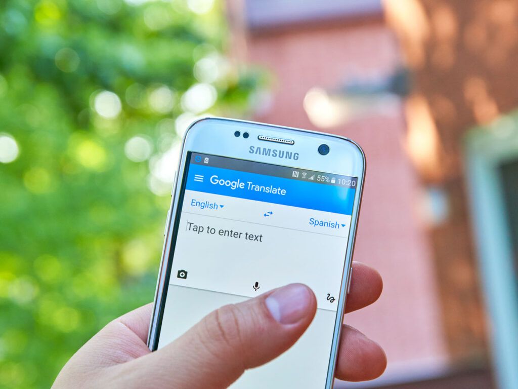 Person using Google Translate feature on phone