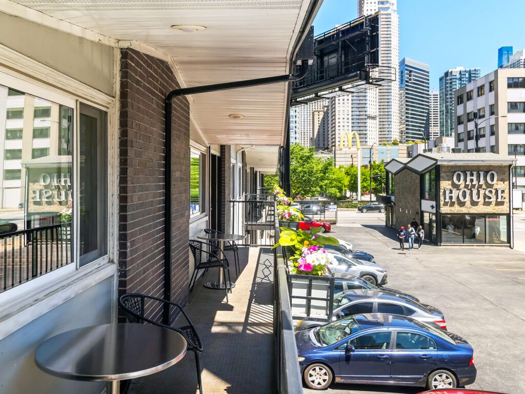 Balcony overlooking parking lot and downtown Chicago at Ohio House