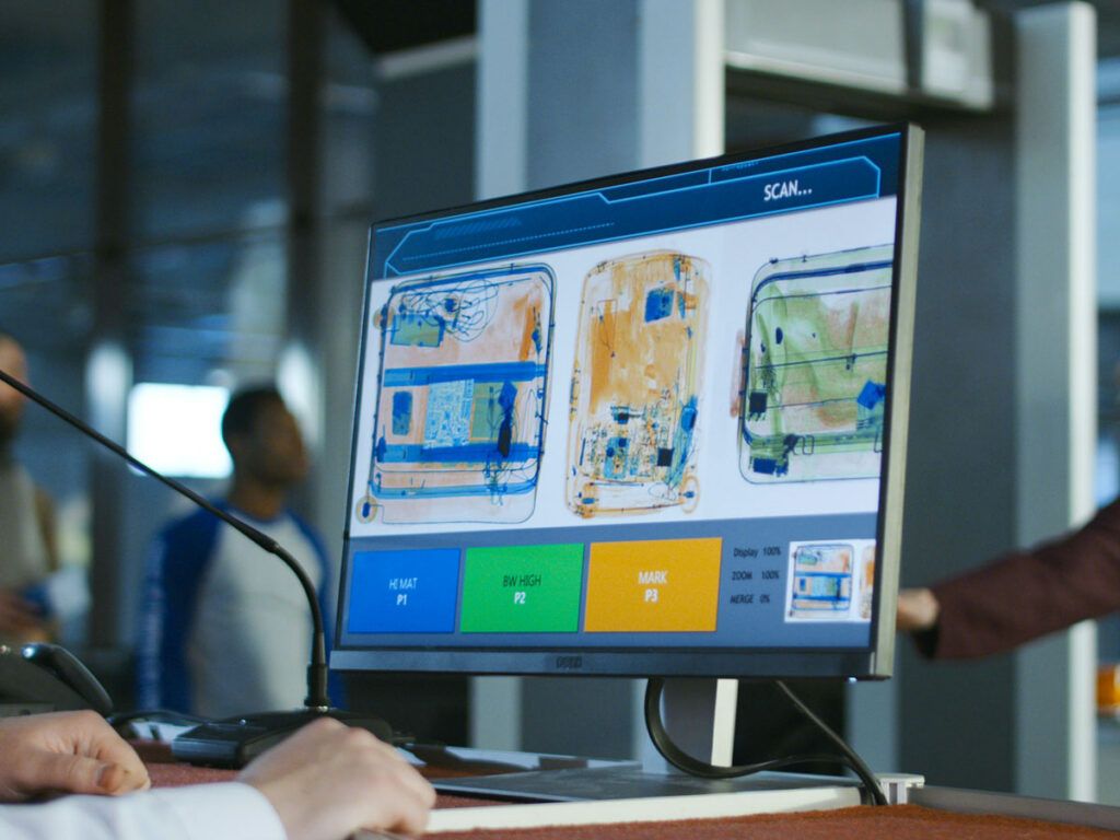 Computer screen with X-ray images of luggage contents