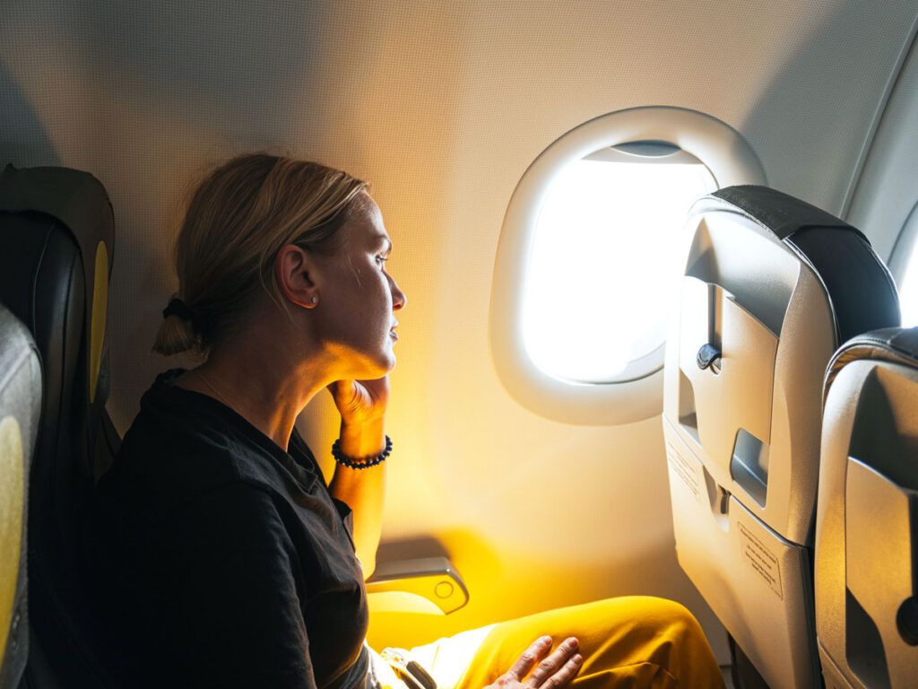 Airline passenger looking out window