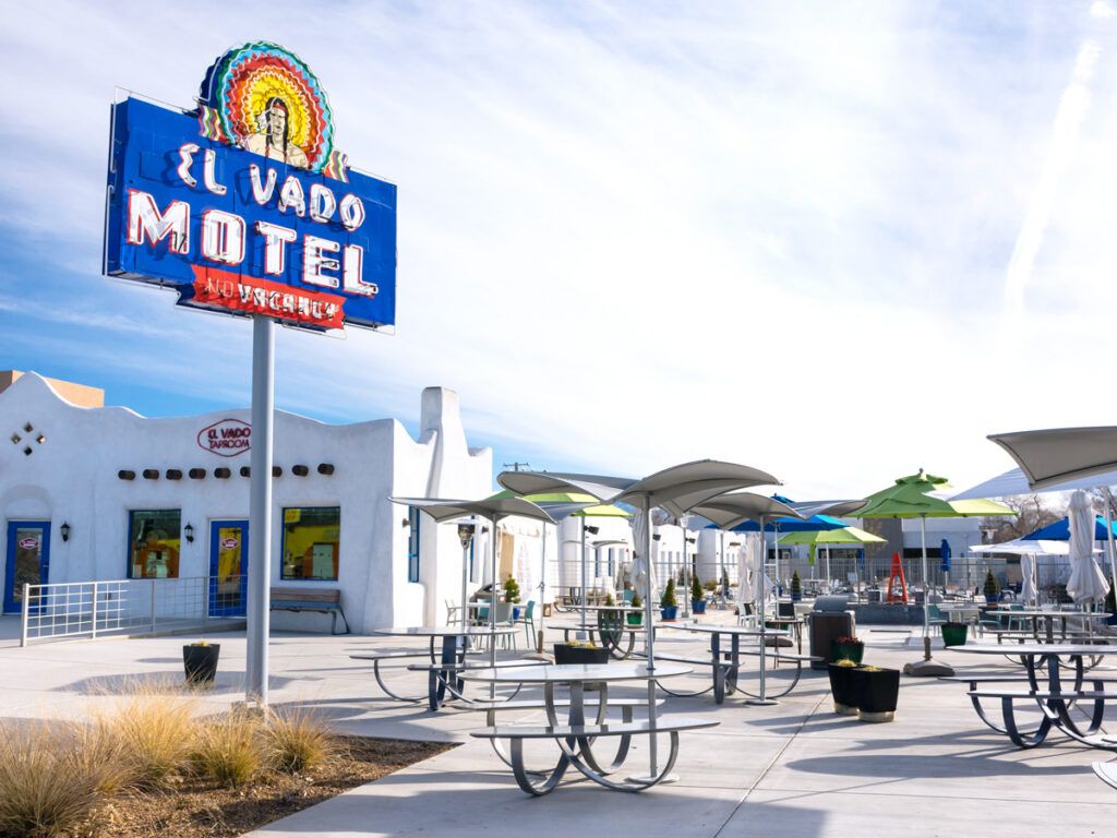 Sign and patio tables in front of El Vado Motel in Albuquerque, New Mexico