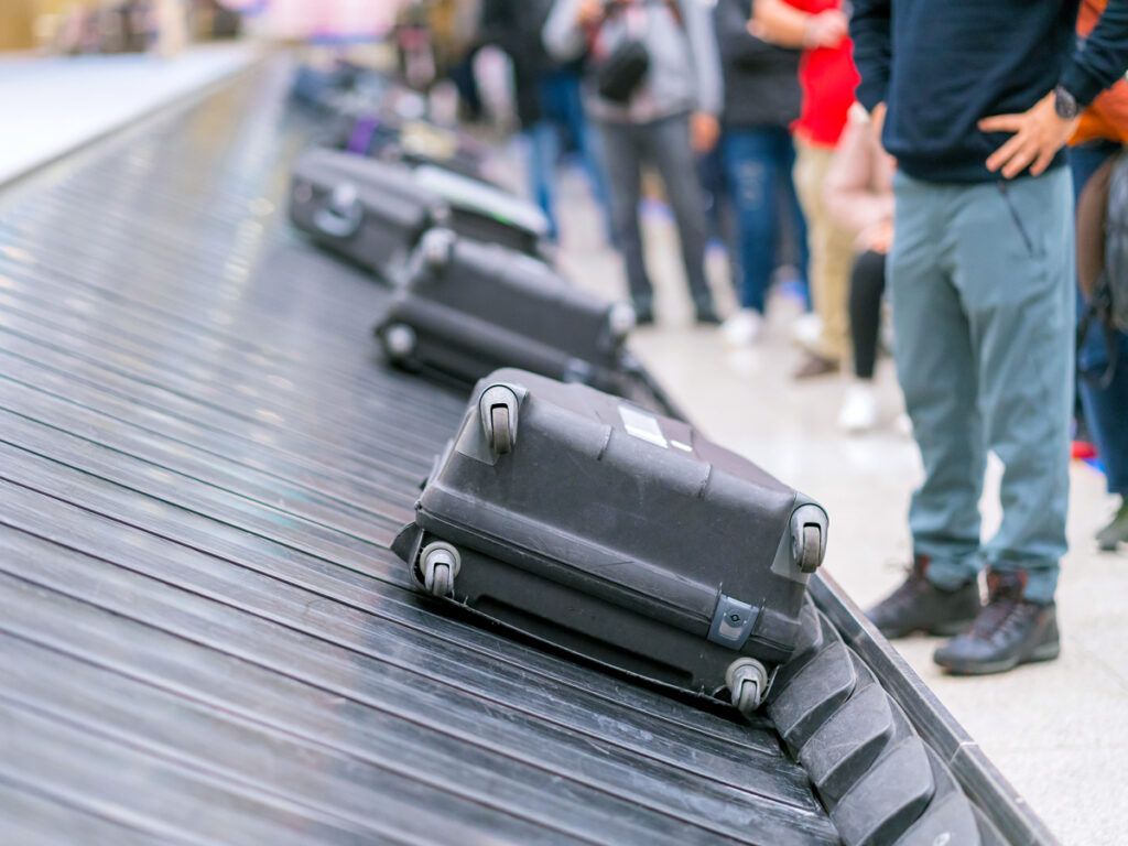 Suitcases on a conveyor belt at the airport