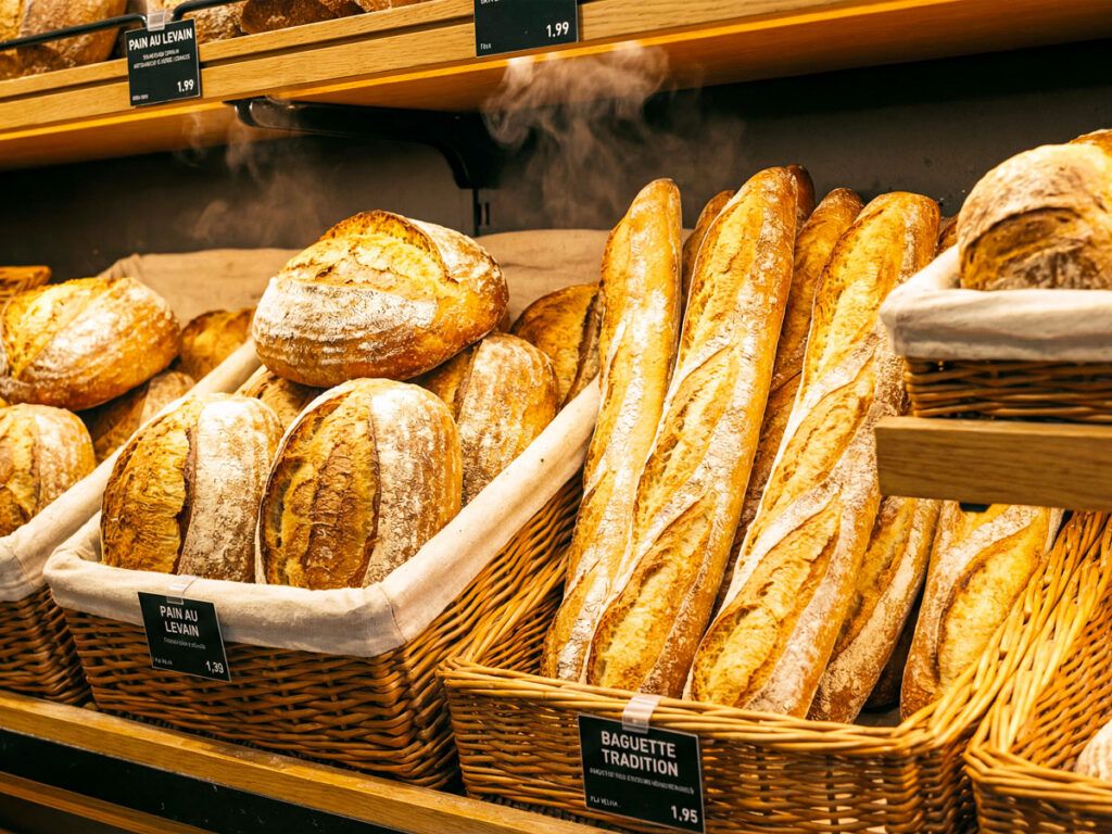 Assortment of freshly baked bread on display in a bakery