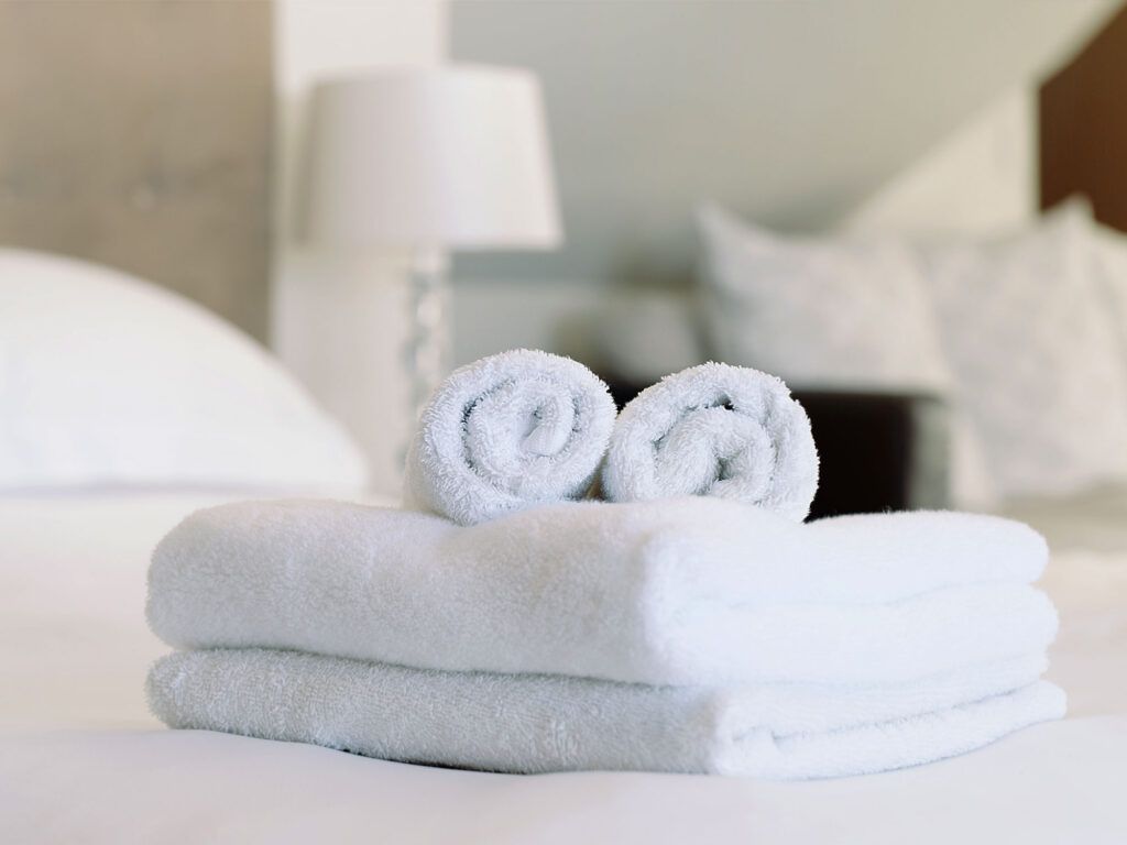 Towels on a bed in a hotel room