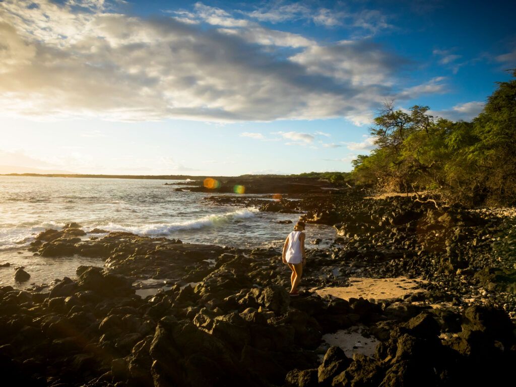 Woman exploring a lava plain in Maui