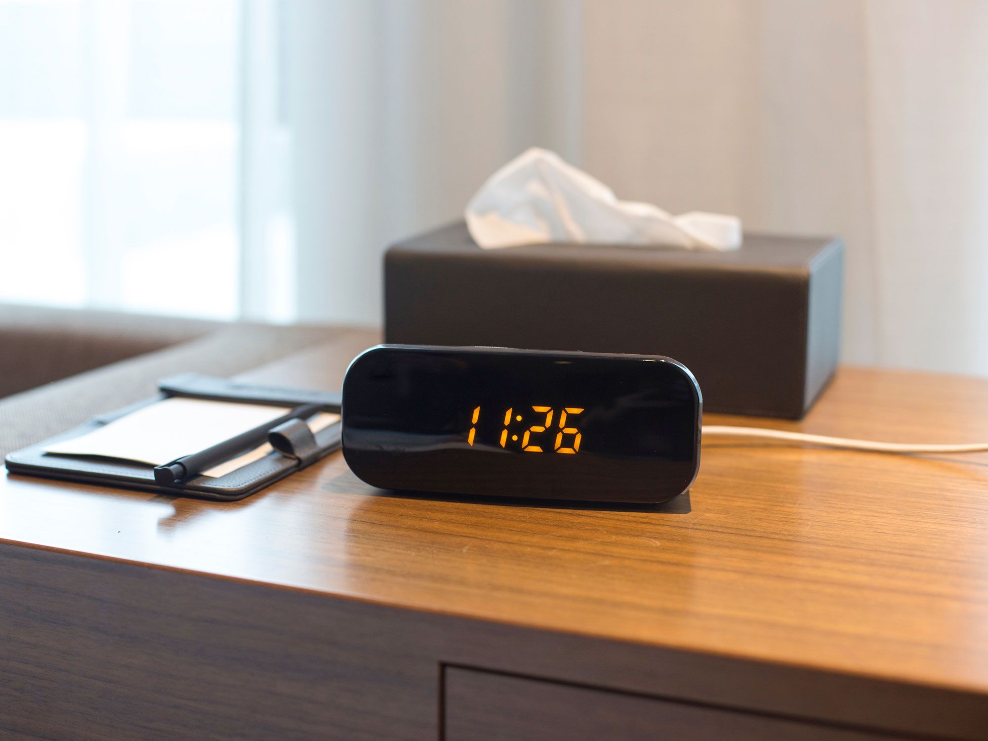 Alarm clock on bedside table