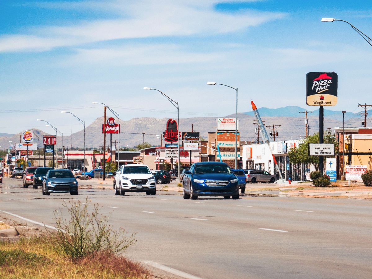 Road lined with fast-food restaurants and gas stations