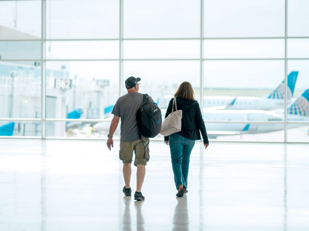 Couple walking through the airport