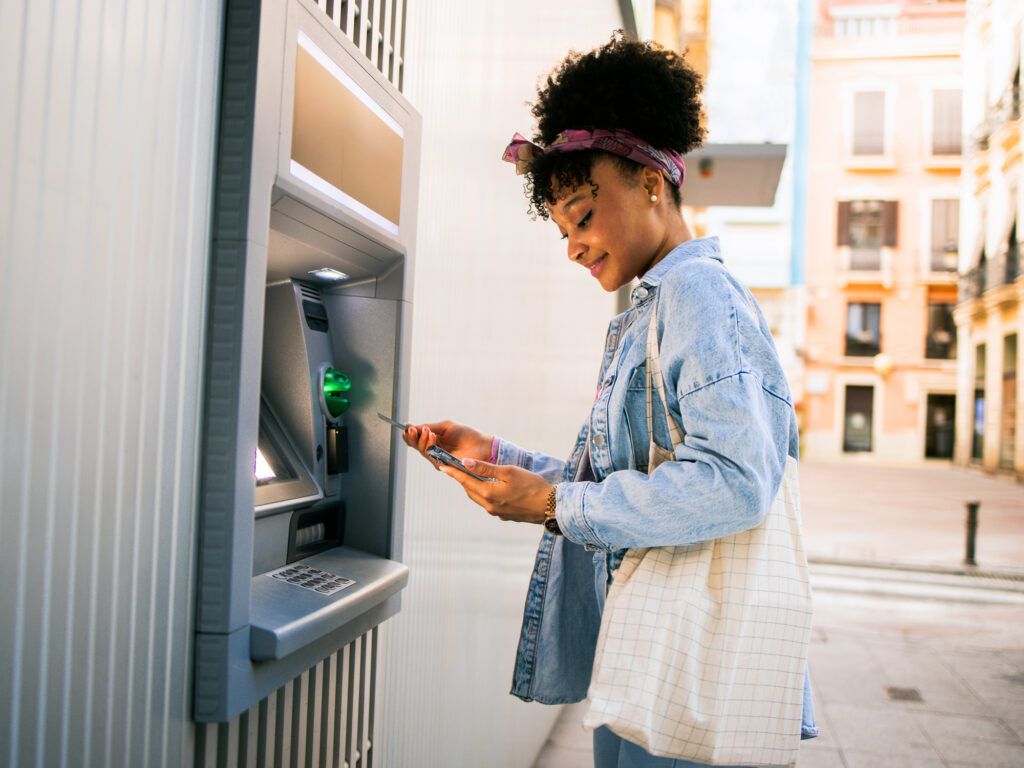A woman using an ATM