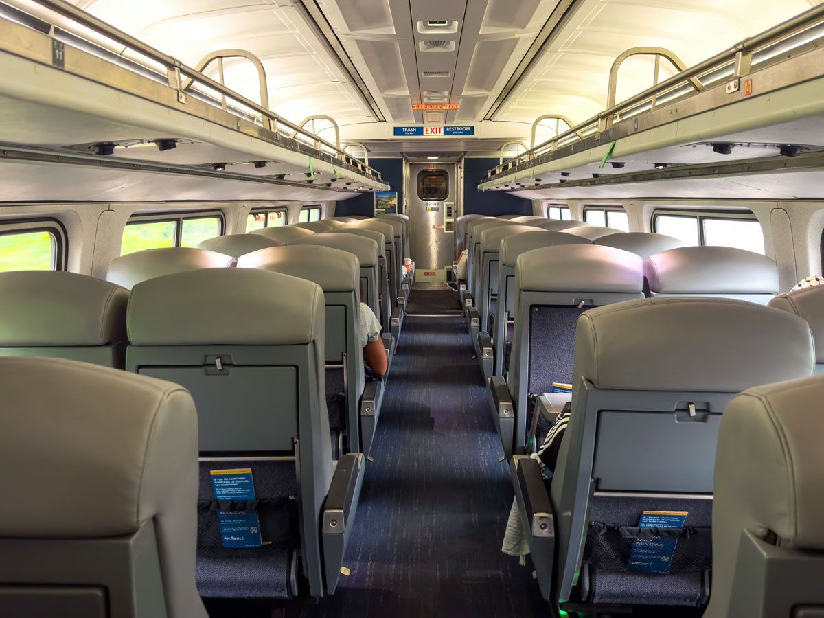 Inside Amtrak train looking from back of car toward front