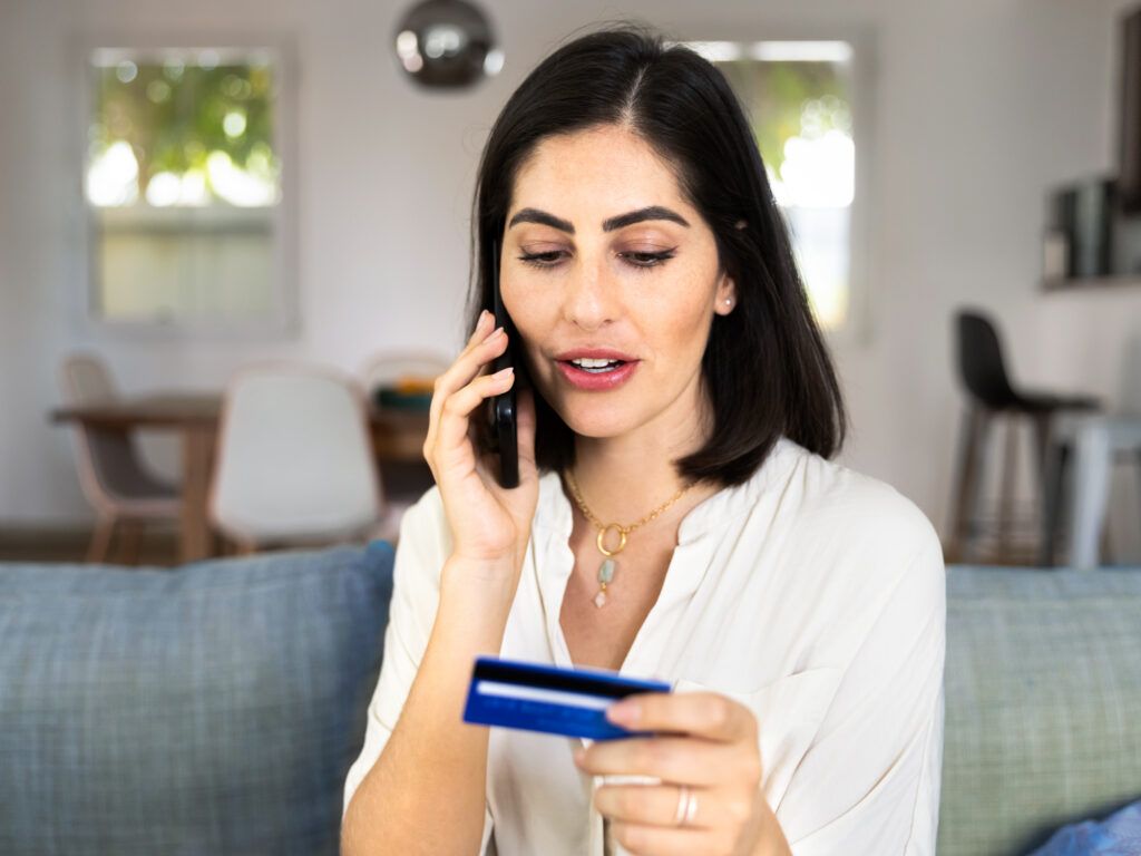 A woman talking on the phone to customer support