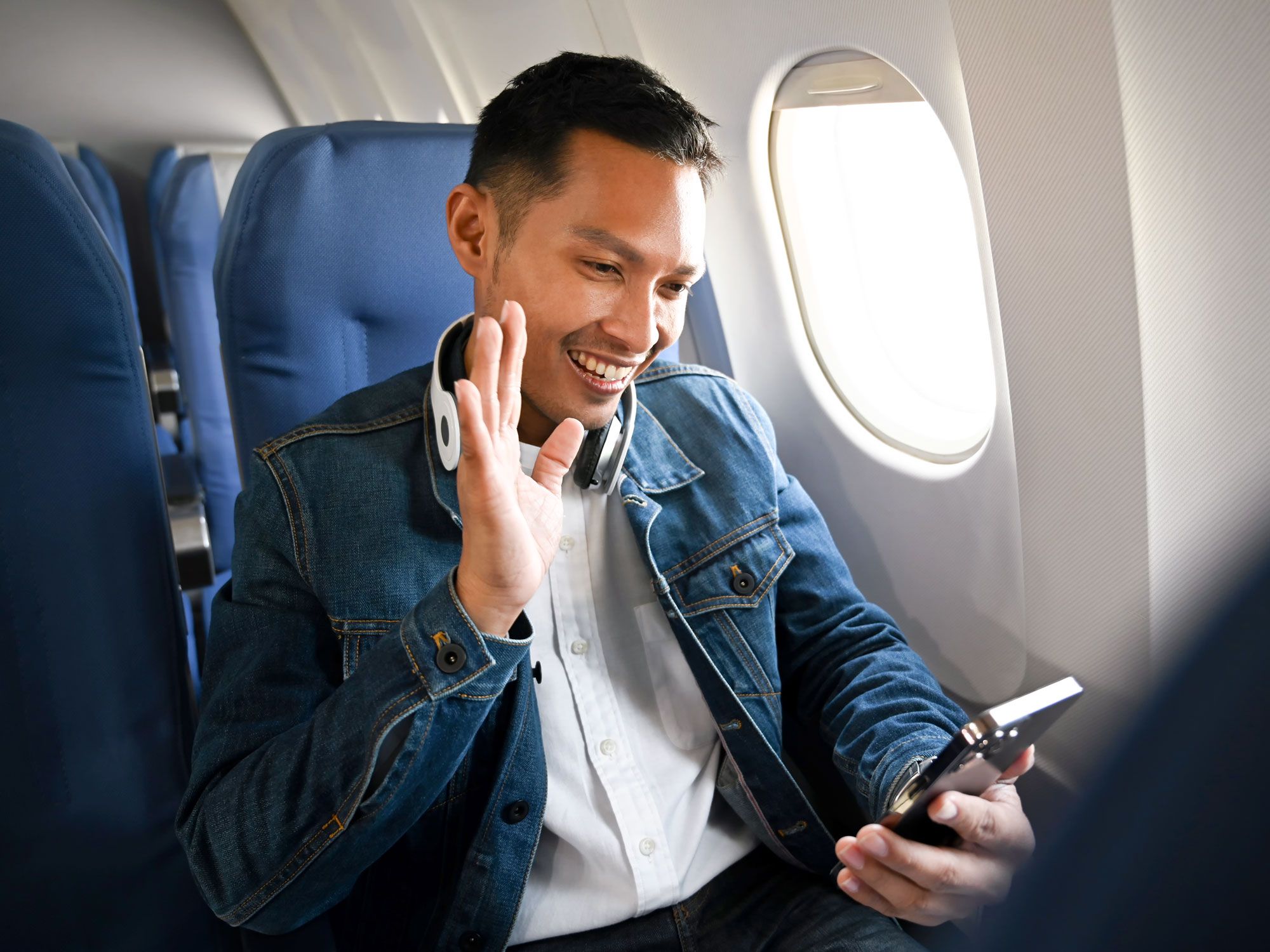 Traveler making video call from seat