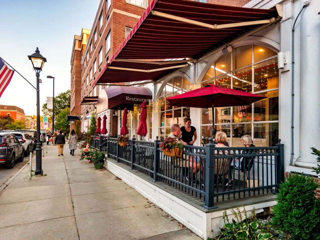 People dine on a restaurant patio in downtown Montpelier, Vermont