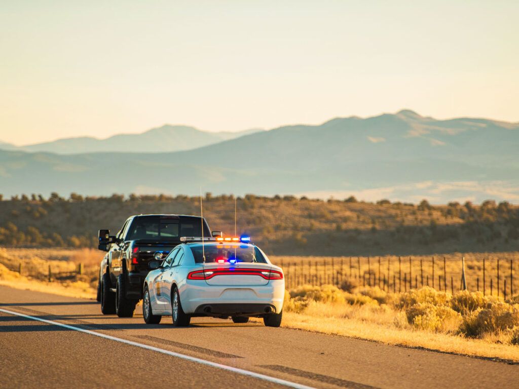 Speeding car being pulled over by a police officer