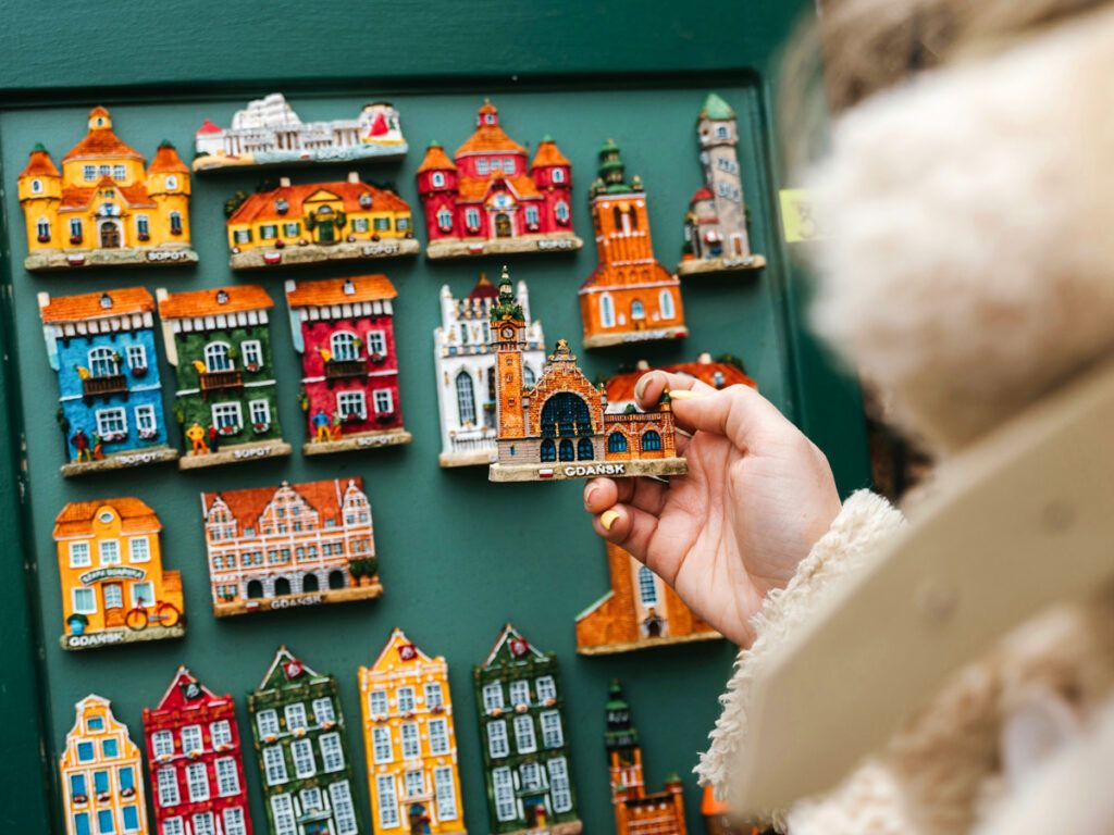 Woman looking at fridge magnets