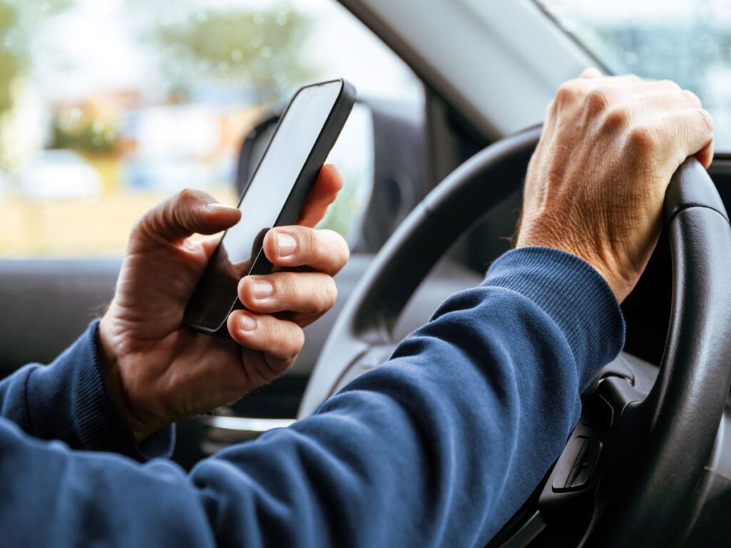 Man texting and driving
