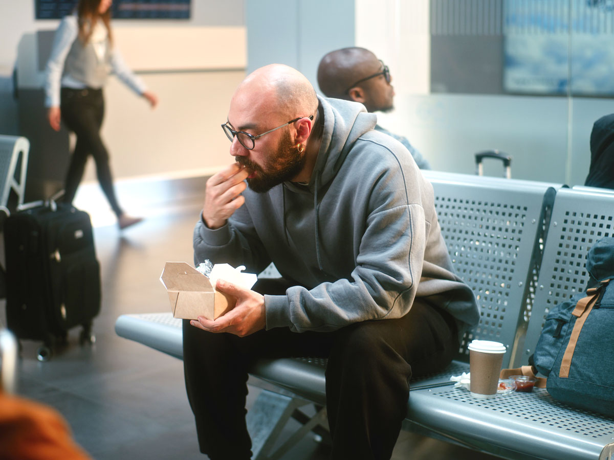 Man eating at the airport